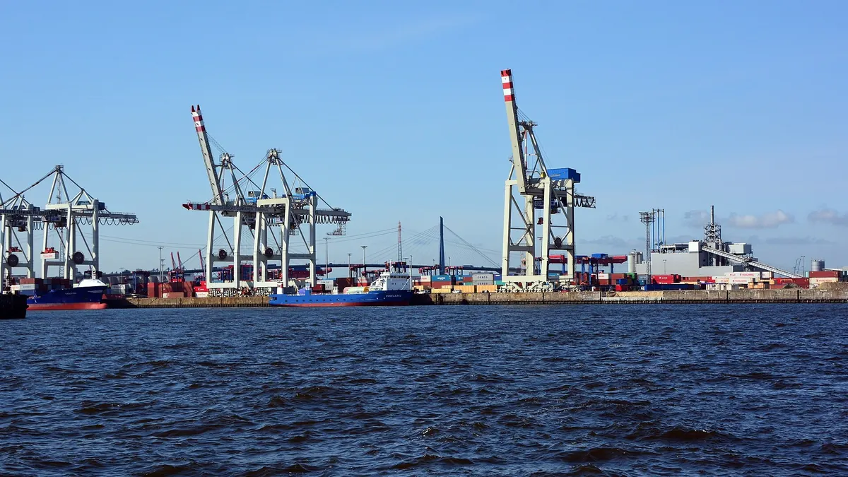 Container terminal with gantry cranes and stacked cargo boxes