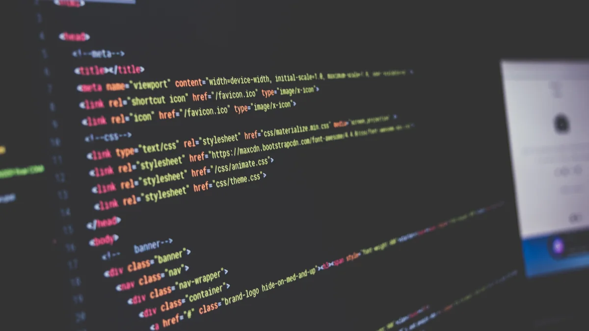 Close-up of colorful code on a dark screen