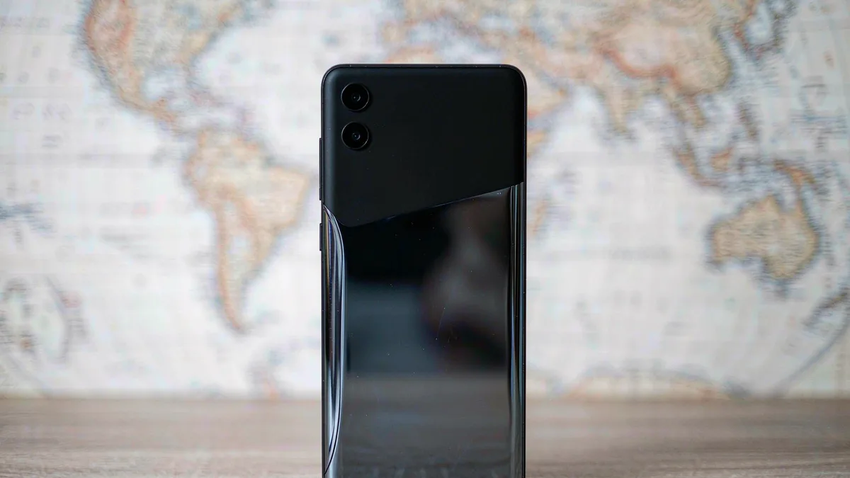 A smartphone with a blurred world map motif
