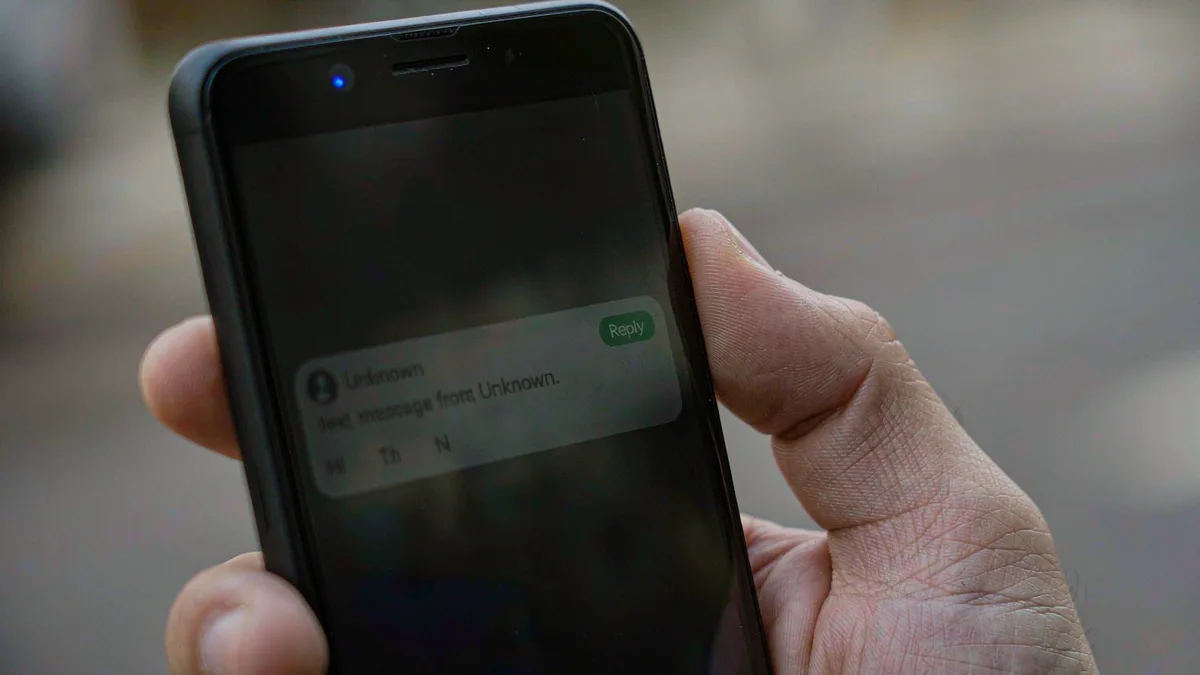 A phone receiving a one-time verification code text message