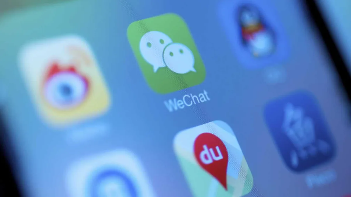 WeChat mobile app on a phone screen beside the desktop build of the same app